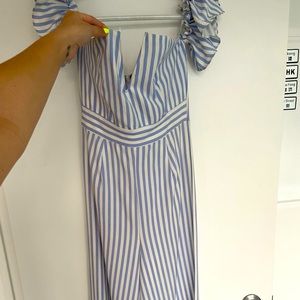 White and blue striped pantsuit with frill, off the shoulder sleeves.
